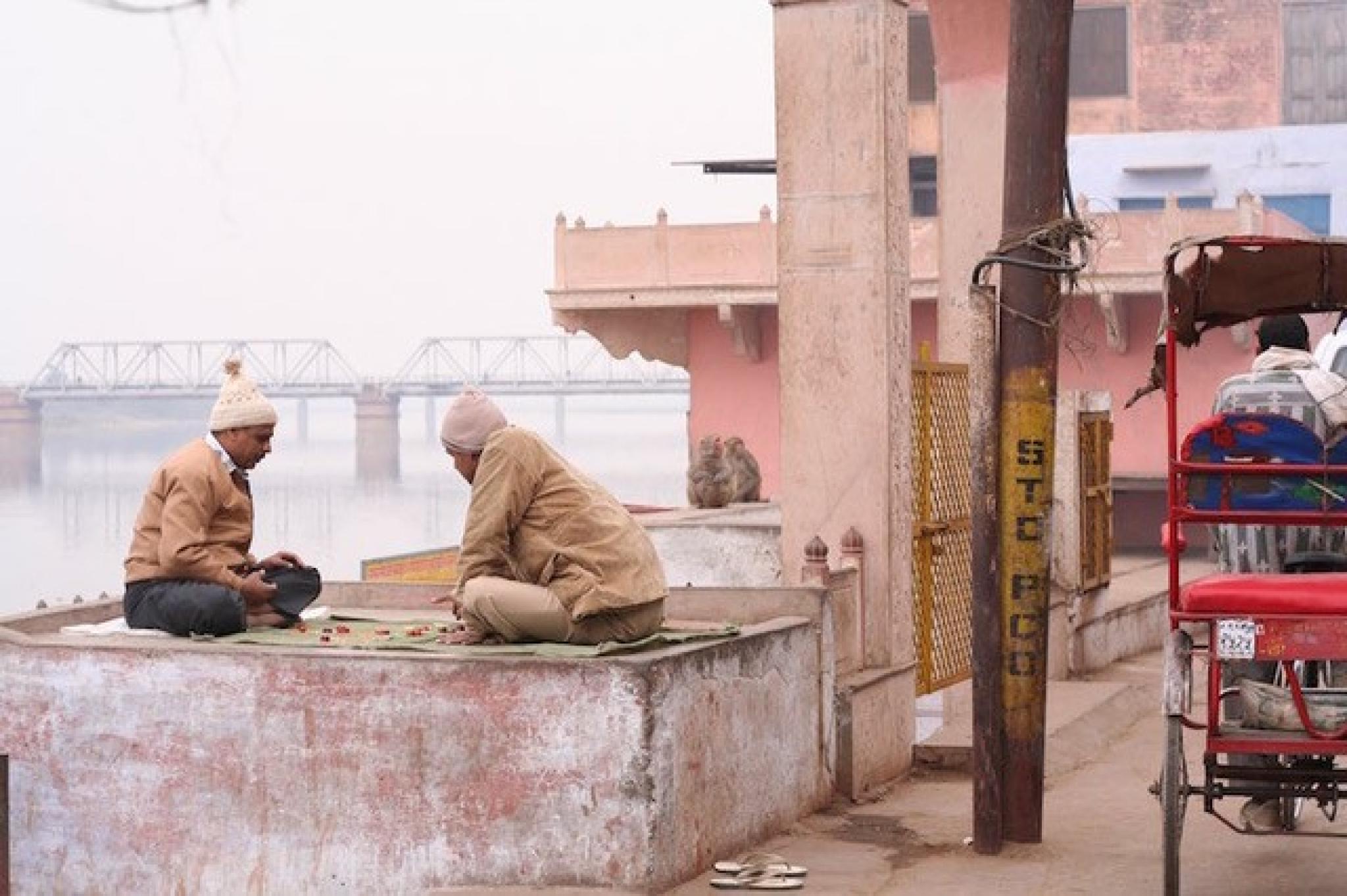 Two men playing checkers