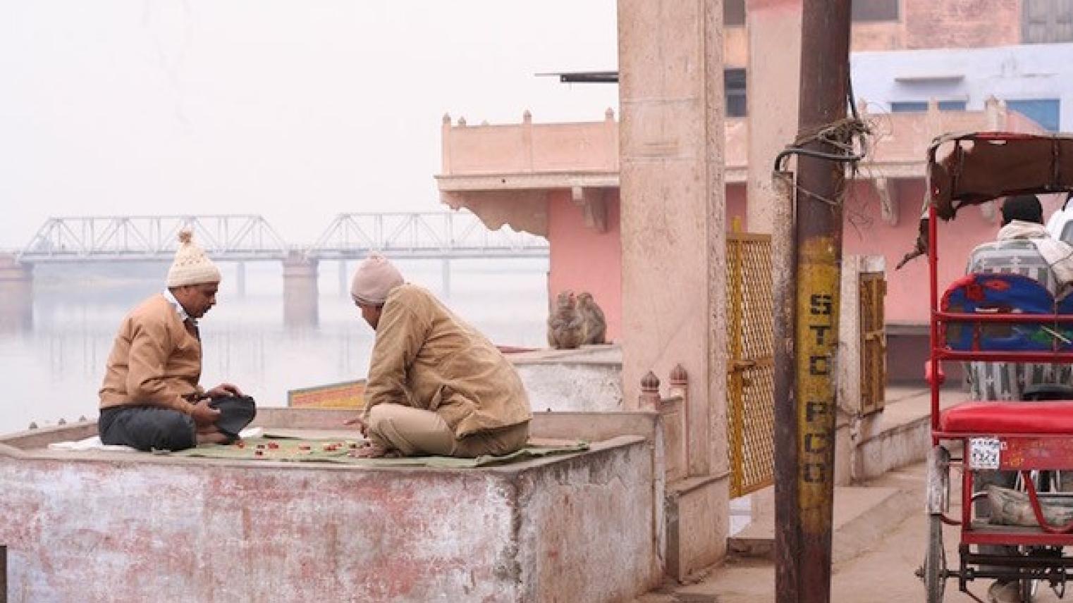 Two men playing checkers